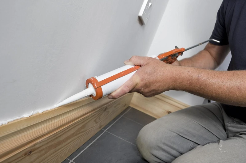 wood baseboards Caulk Gaps